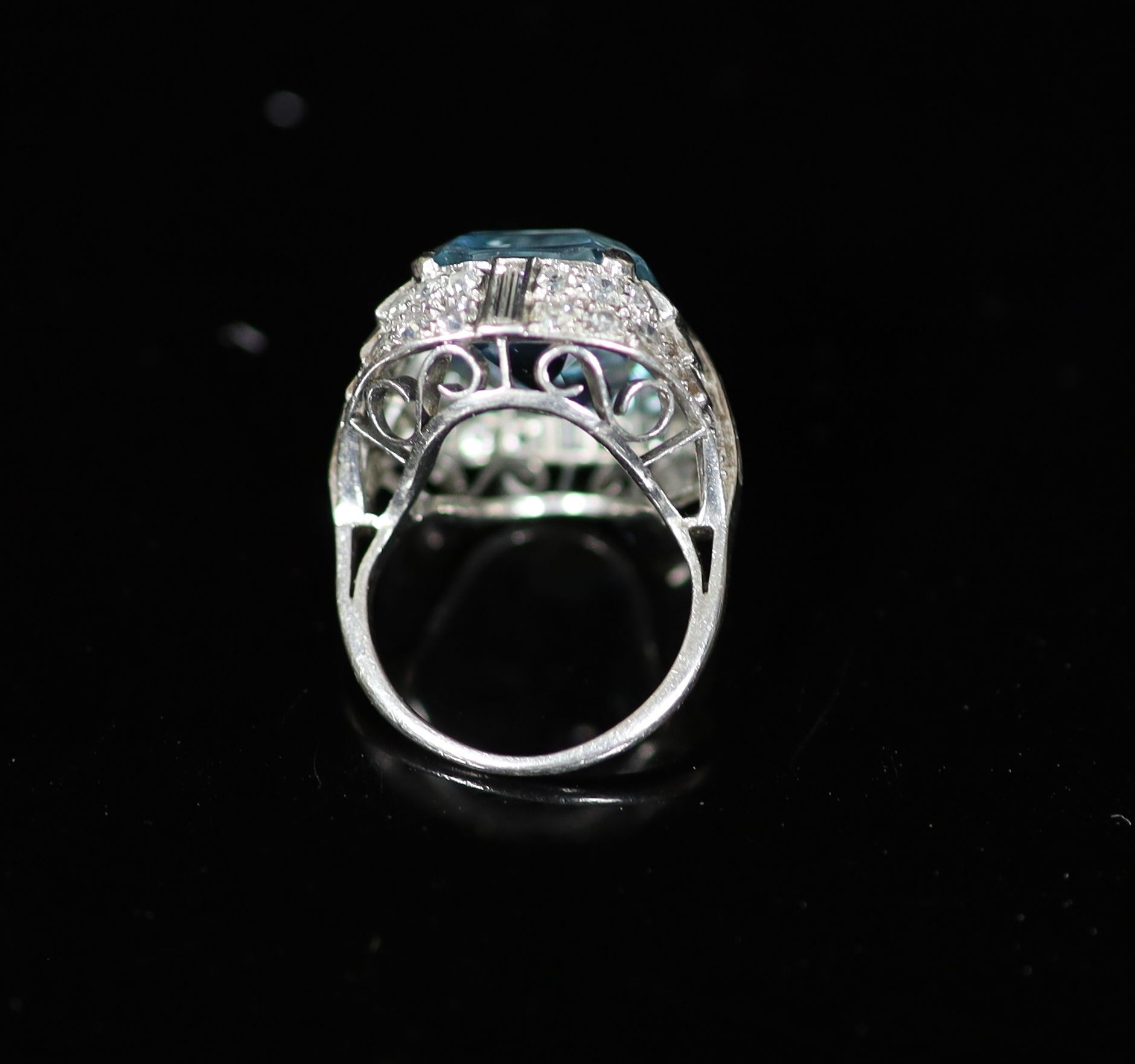 A 1930's/1940's platinum?, emerald cut aquamarine, round and baguette cut diamond set dress ring